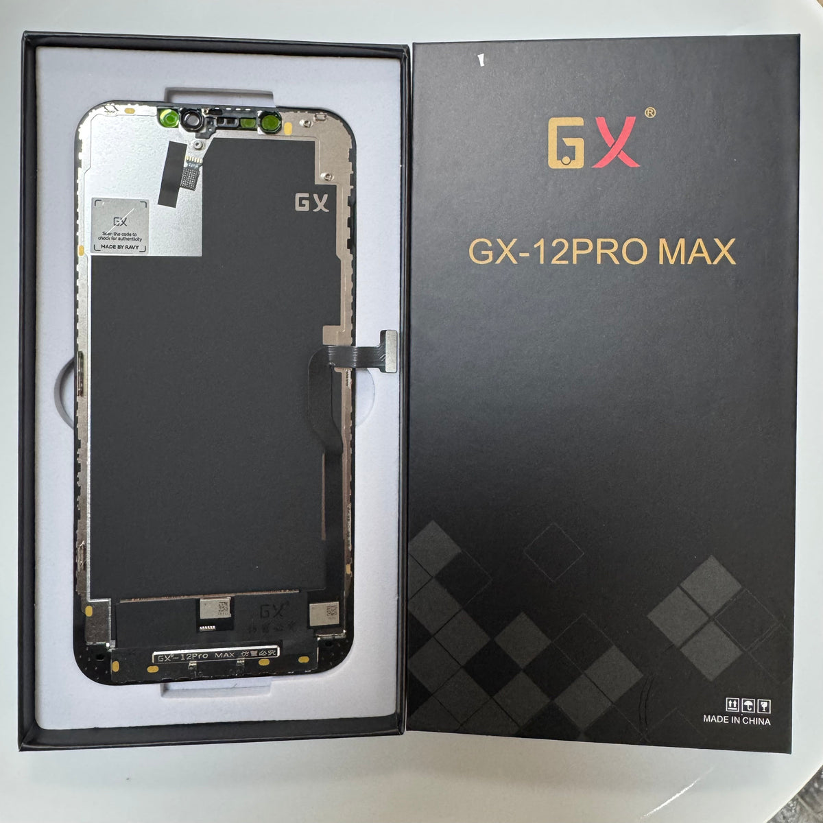 Hard OLED screen for iPhone 12 Pro Max in its tray, beside its labelled box