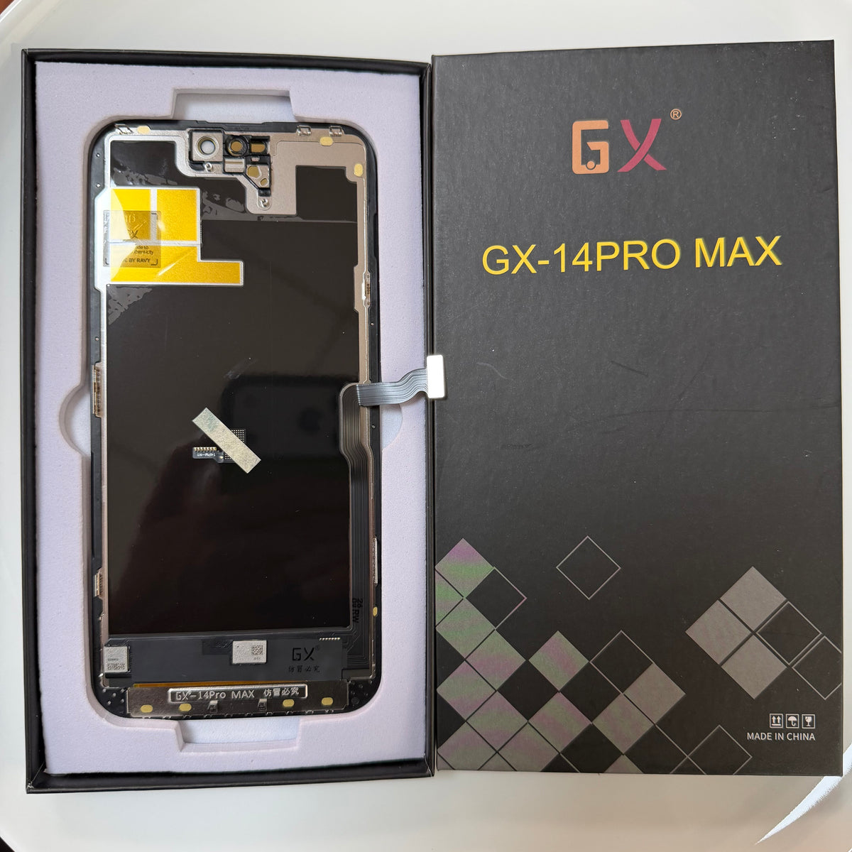 Soft OLED screen for iPhone 14 Pro Max in its tray, beside its labelled box